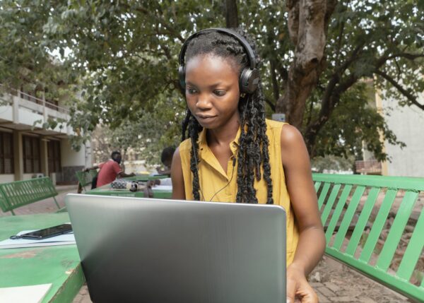 medium-shot-woman-studying-with-laptop